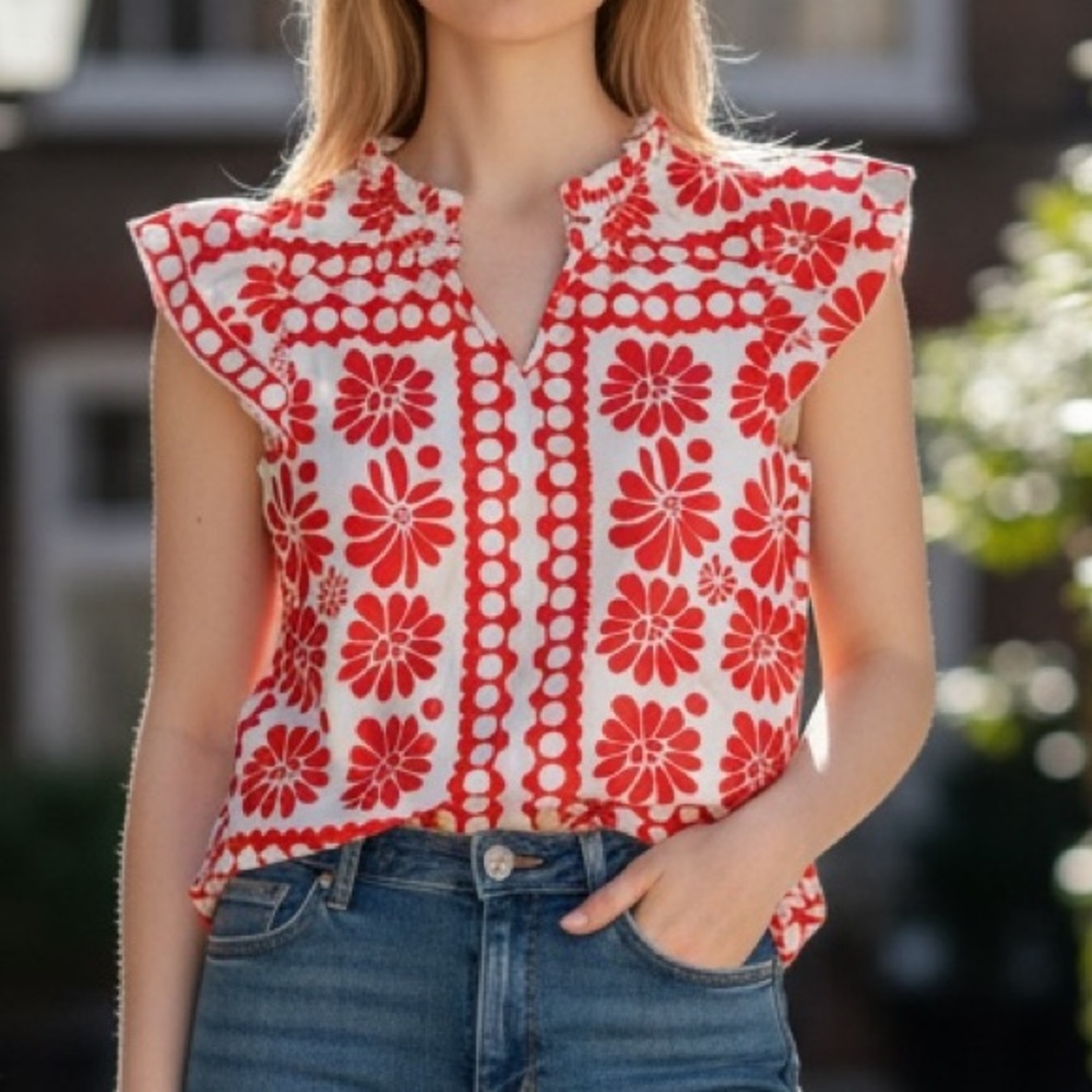 Red and white short sleeve floral blouse.